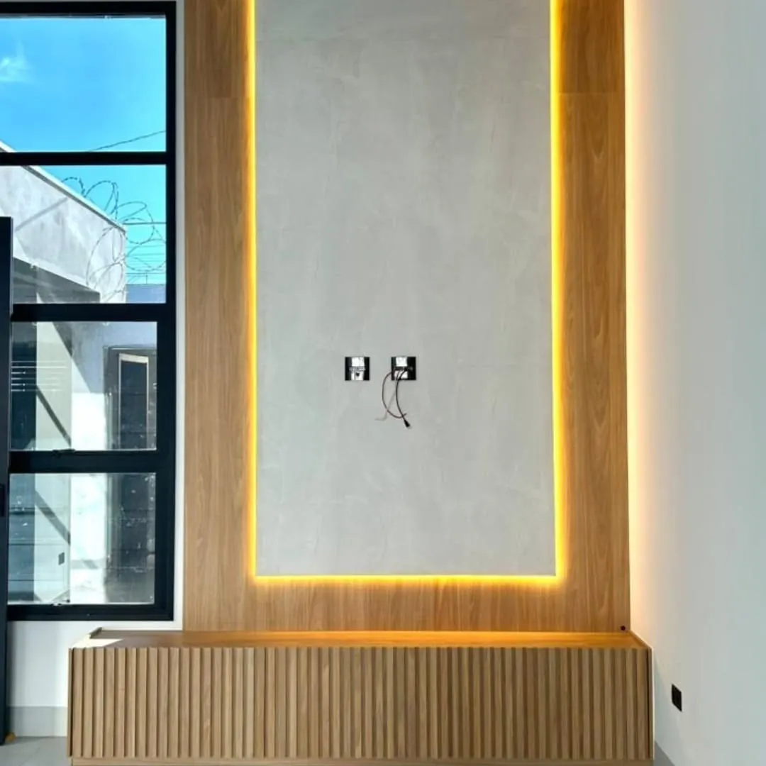 Painel de TV e sala planejada na obra Residencial Portinari, projeto da RW Móveis Planejados, foto 3